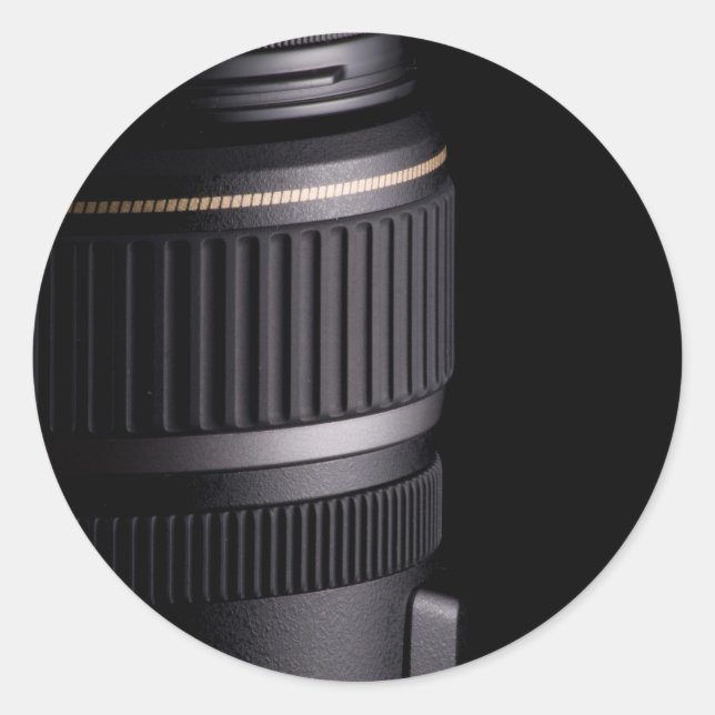 Close up of modern camera lens on black background classic round sticker (Front)