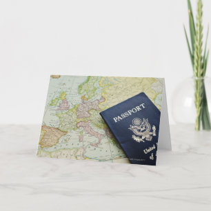 Close-up of passport lying on European map Card
