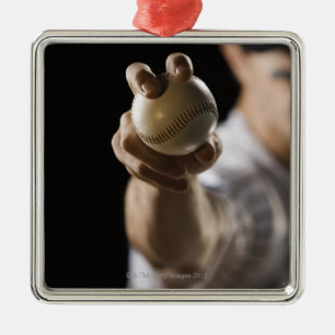 Close up of pitcher holding baseball metal ornament