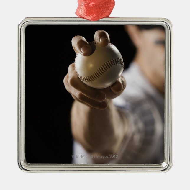 Close up of pitcher holding baseball metal ornament (Front)