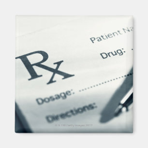 Close up of prescription pad and pen magnet
