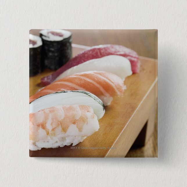 Close-up of sushi on a table pinback button (Front)