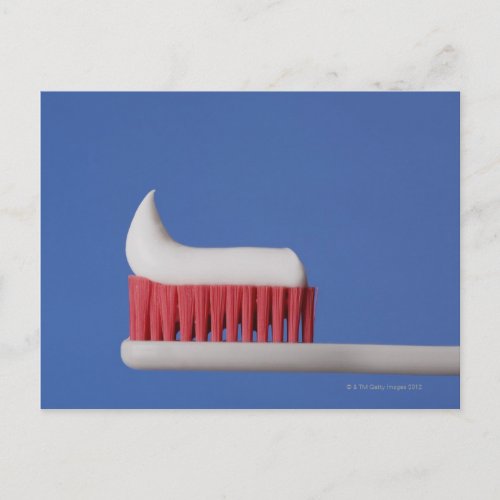 Close_up of toothpaste on a toothbrush postcard