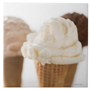 Close up of various ice cream cones tile