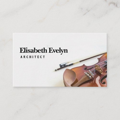 Close_up of violin string with bow on white business card