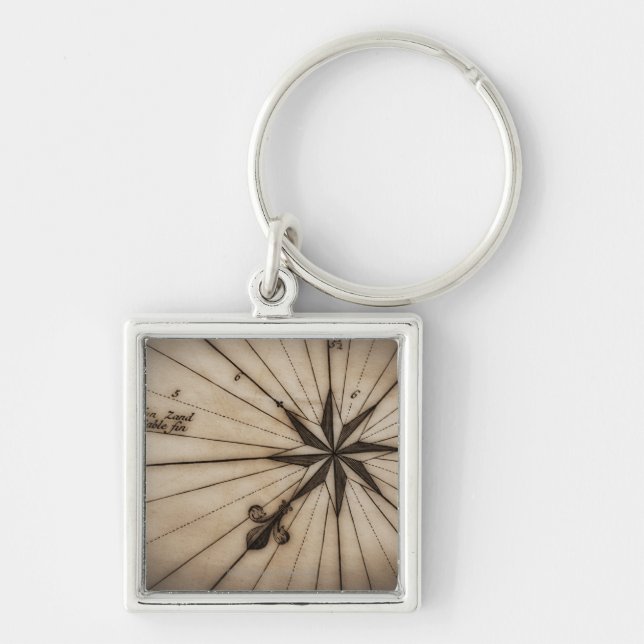 Close up of wind rose on antique map keychain (Front)