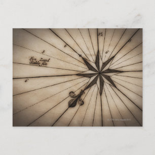 Close up of wind rose on antique map postcard