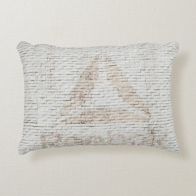 Close-up photo of Reebok logo on wall Accent Pillow (Front)