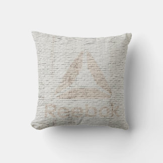 Close-up photo of Reebok logo on wall Throw Pillow