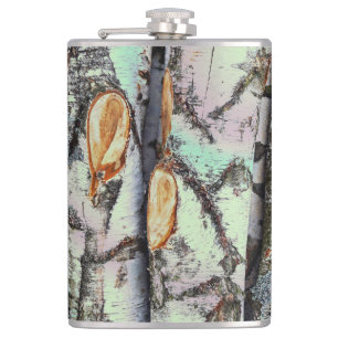 Close-up scene of birch log stumps, rustic charm flask