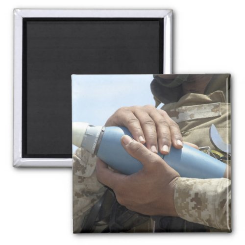 Close_up view of a soldier cradling a munition magnet