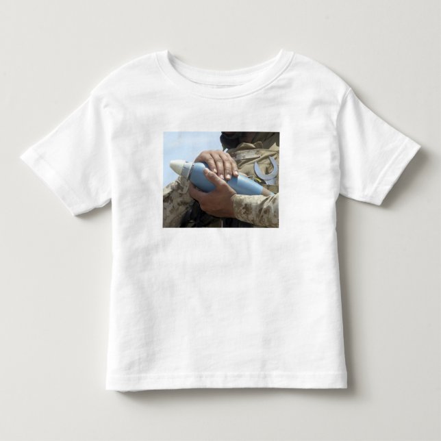 Close-up view of a soldier cradling a munition toddler t-shirt (Front)