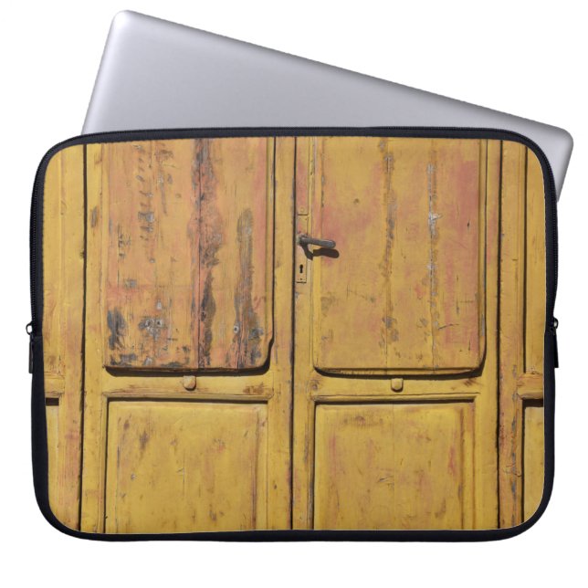 Closed brown wooden cabinet laptop sleeve (Front)