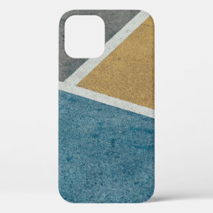 Closeup gray, yellow, and blue painted pavement iPhone 12 case