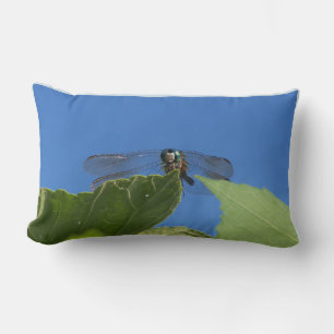 Closeup of a dragonfly against a bright blue sky lumbar pillow