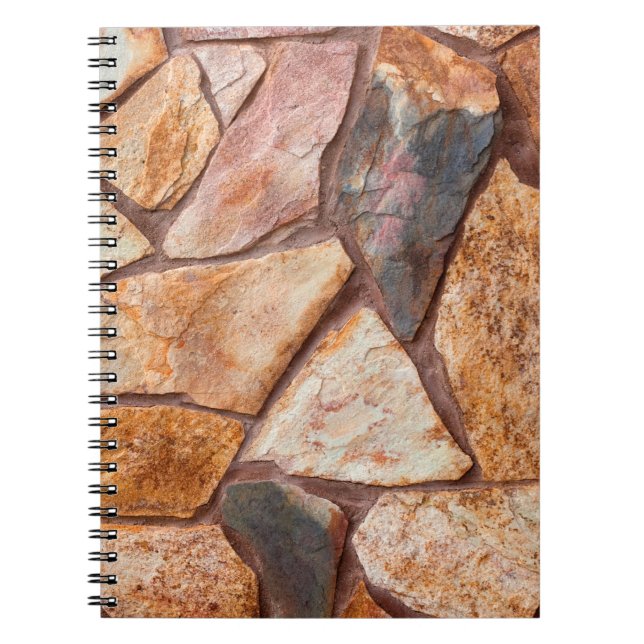 Closeup of a stone wall as a backgroundwallpaper,p notebook (Front)