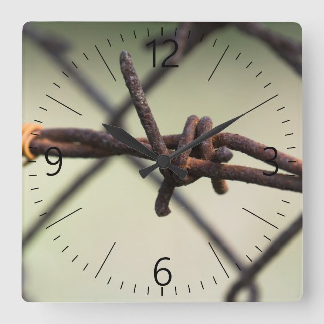 Closeup of barbed wire square wall clock (Front)