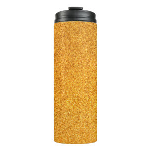 Closeup of golden matte metal texture. Shiny metal Thermal Tumbler