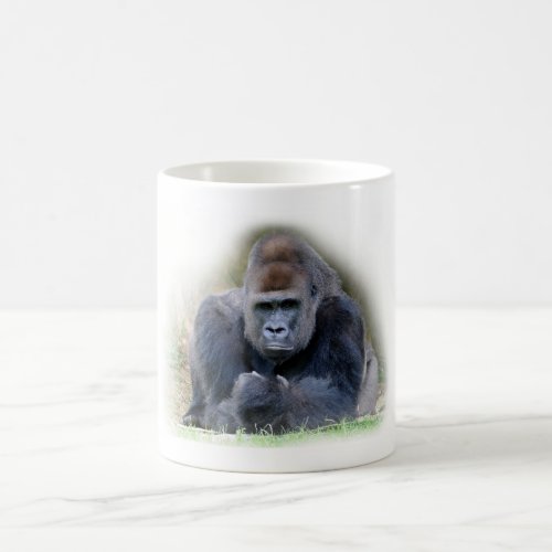 Closeup of gorilla lying on grass coffee mug