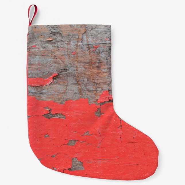Closeup old and peeling painted wood board backgro small christmas stocking (Front)