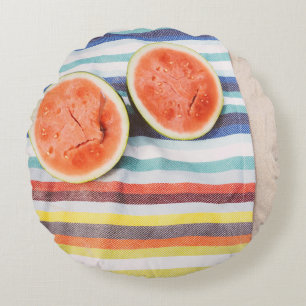 Closeup photo of slice watermelon fruits on cloth round pillow