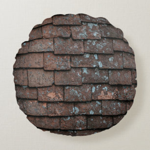 Closeup photography of brown and gray concrete bri round pillow