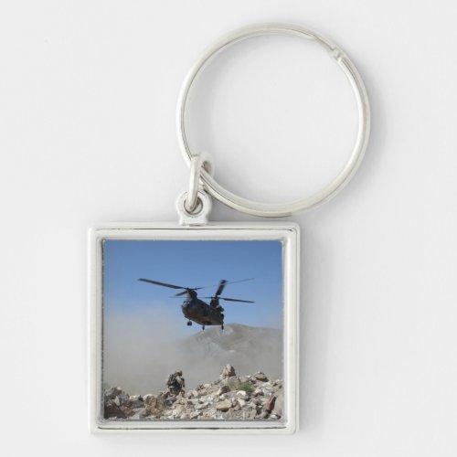 Clouds of dust kicked up by the rotor wash keychain