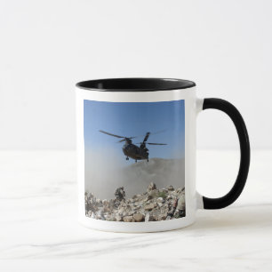 Clouds of dust kicked up by the rotor wash mug