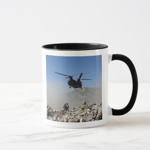 Clouds of dust kicked up by the rotor wash mug