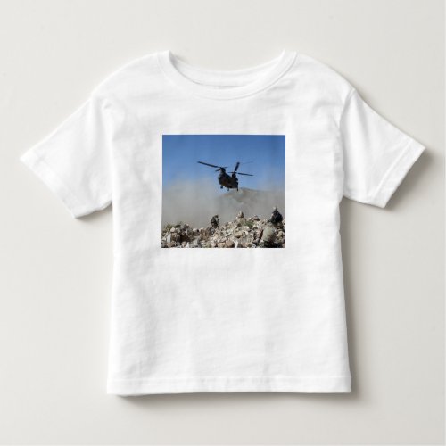 Clouds of dust kicked up by the rotor wash toddler t_shirt