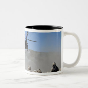 Clouds of dust kicked up by the rotor wash Two-Tone coffee mug