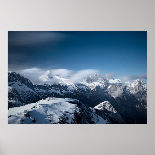 Clouds rolling above snowy mountains poster