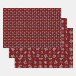 Cluster of Snowflakes on Deep Red Wrapping Paper Sheets