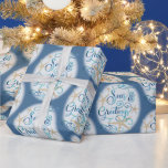 Coastal Beach Christmas SEAS & GREETINGS Wrapping Paper<br><div class="desc">Wrap your Christmas holiday gifts in coastal or beach flair using this roll of wrapping paper featuring a SEAS & GREETINGS elegant calligraphy script typography design accented with starfish in turquoise aqua blue on your choice of background color (shown with a dark blue color). ASSISTANCE: For help with design modification...</div>