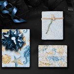 Coastal Chic | Modern Blue and Gold Under the Sea Wrapping Paper Sheets<br><div class="desc">Whimsical dusty blue and gold hand-painted nautical watercolor "under the sea" beach design brings a modern twist to an old theme. The collection features seashells, starfish, a seahorse, and coral reef in complimenting shades of blue, gold, and off white with a splash of blue for a water effect. For other...</div>