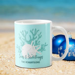Coastal Christmas Beach Seas and Greetings Coffee Mug<br><div class="desc">Personalize this beachy Christmas mug with for a unique gift or your own holiday decor. The mug features aqua blue glitter coral, white sand dollar and starfish, and the holiday message “Seas & Greetings”, on a light aqua blue background. *If you would like this design on more products or need...</div>