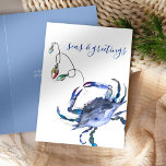 Coastal Christmas Blue Watercolor Crab Beach Card<br><div class="desc">Celebrate the holidays with a coastal twist using this charming holiday card! Featuring a replica of my original hand-painted watercolor crab adorned with Christmas lights in shades of red, green, blue, and turquoise on a crisp white background, this card brings a festive beach vibe to your greetings. The phrase "Seas...</div>