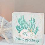 Coastal SEAS & GREETINGS Glitter Coral Starfish Wooden Box Sign<br><div class="desc">Decorate for the Christmas holiday season with this coastal or beach-themed wood box sign featuring gold and turquoise glitter starfish and coral, sand dollars, and a gold glitter SEAS & GREETINGS typography design. ASSISTANCE: For help with design modification or personalization, color change, resizing, transferring the design to another product or...</div>