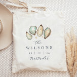 Coastal Watercolor Oyster Wedding Favor Tote Bag<br><div class="desc">These coastal wedding favor tags feature a grouping of soft cream and aqua watercolor oyster shell illustrations,  with your names,  wedding date,  and location in classic navy blue lettering. Perfect for beach themed,  summer,  or nautical weddings,  personalize these totes and fill them with goodies as a welcome gift.</div>