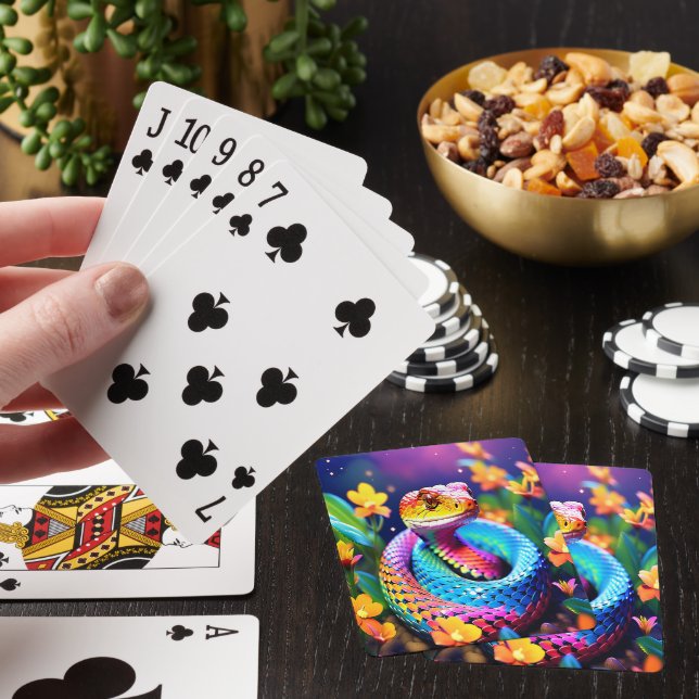 Cobra snake with vibrant turquoise pink and yellow poker cards (In Situ)