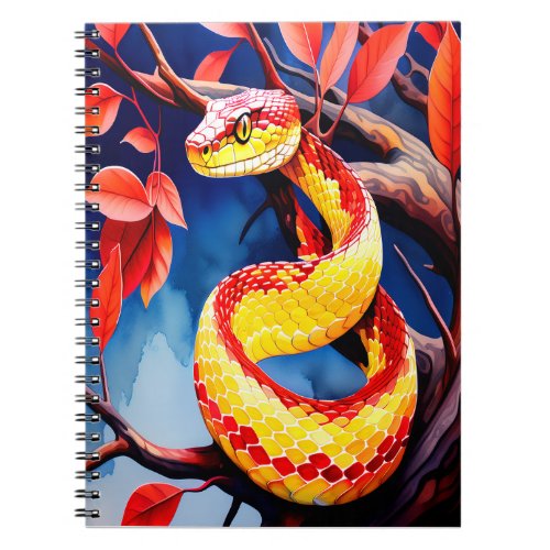 Cobra with vibrant red and yellow scales in tree notebook