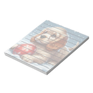 Cocker Spaniel Puppy Resting on Snow With a Ball Notepad