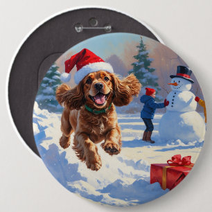 Cocker Spaniel Running in Snow with Christmas Hat Button