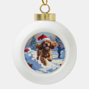 Cocker Spaniel Running in Snow with Christmas Hat Ceramic Ball Christmas Ornament