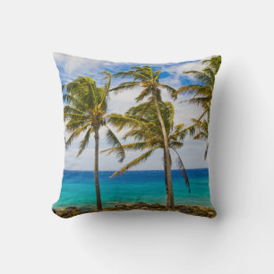 Coconut palm trees (Cocos nucifera) swaying in Throw Pillow