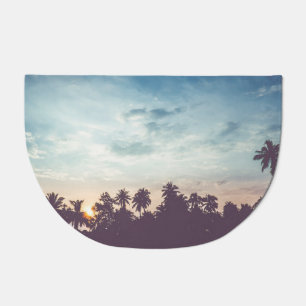 Coconut tree silhouette, tropical sunset. doormat