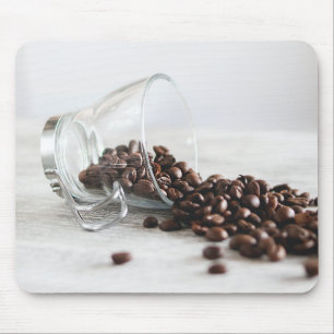 Coffee Beans Spilling out of a Clear Coffee Cup Mouse Pad