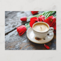 coffee cup on a rustic base with red tulips