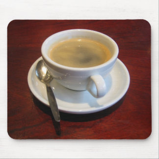 Coffee cup on wooden table mouse pad