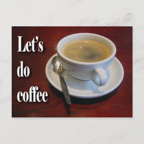 Coffee cup on wooden table postcard